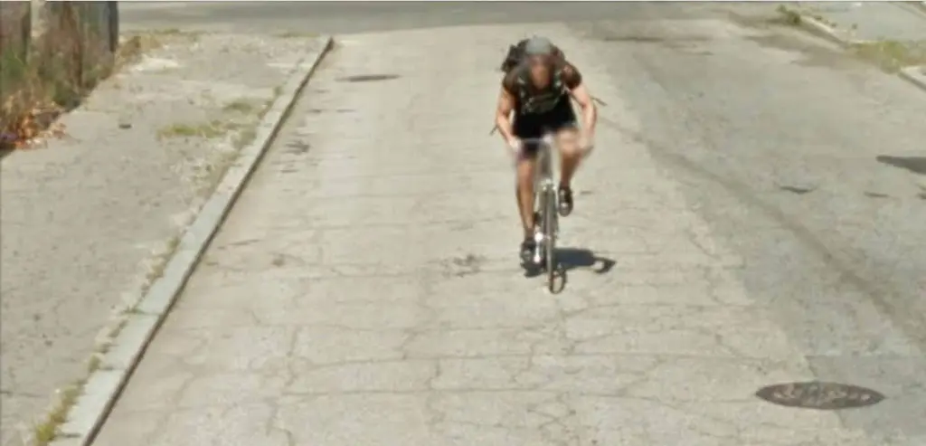 Mark Condor riding a bicycle uphill
